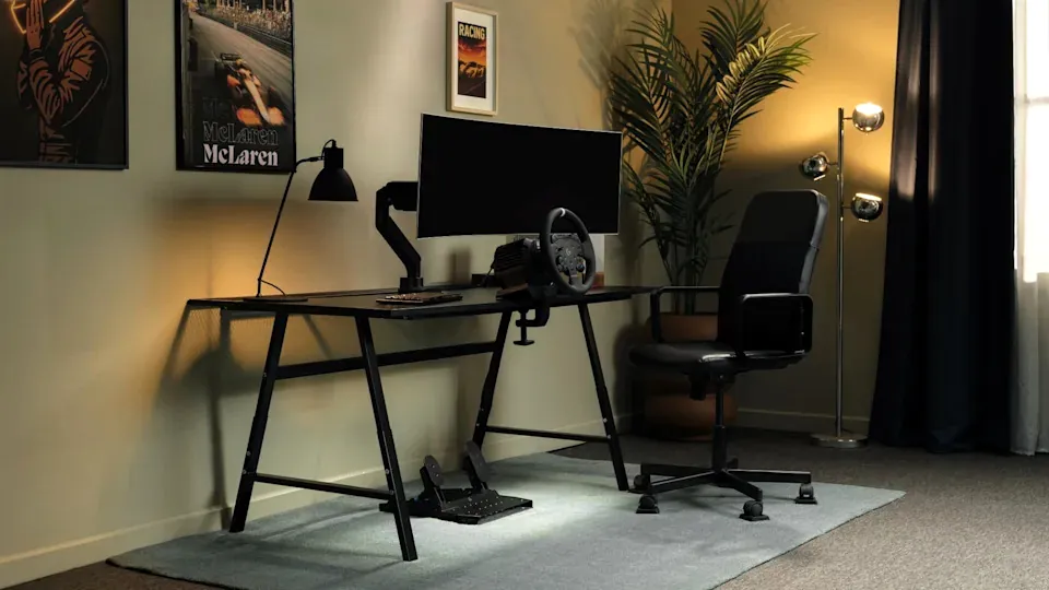 The RS50 System shown alongside the McLaren-branded peripherals.