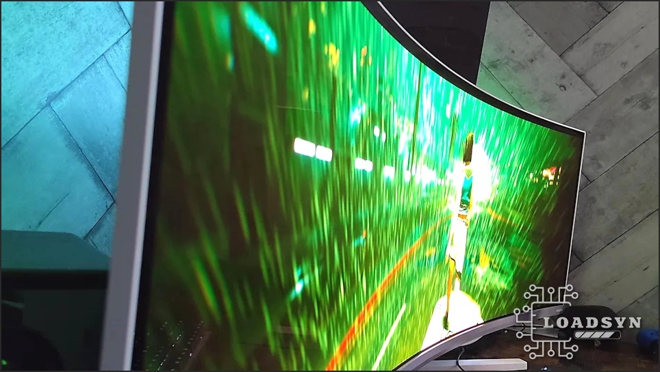 Side image of Philips Evnia monitor showing connectivity ports and ergonomic stand.