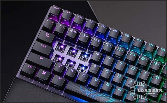 Close-up of ROG Strix Scope II 96 Wireless with six keys removed to show the hot-swappable sockets and internal structure.