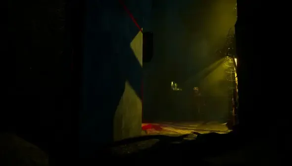 A dark, ominous scene from SLEEP AWAKE. A character is silhouetted in a lit doorway, with light rays piercing through the dark environment.