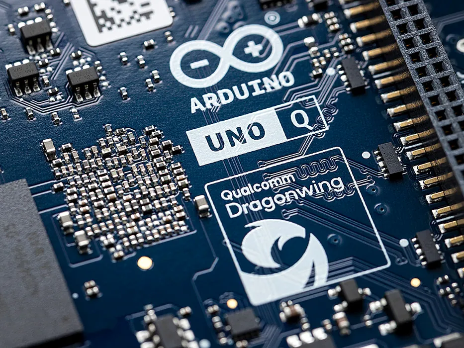 Close-up of an Arduino Uno Q board with Qualcomm Dragonwing logo.