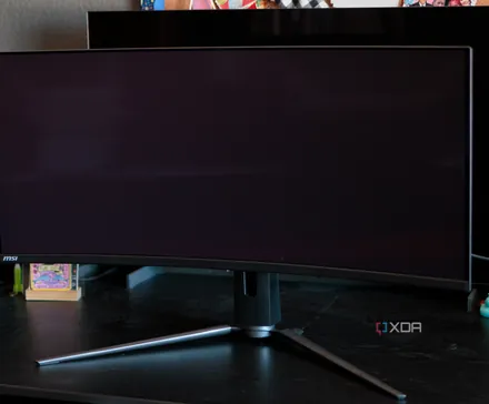 A comparison of the black levels with the MSI MAG 341CQP QD-OLED in the front and the LG 42C2 W-OLED behind it.