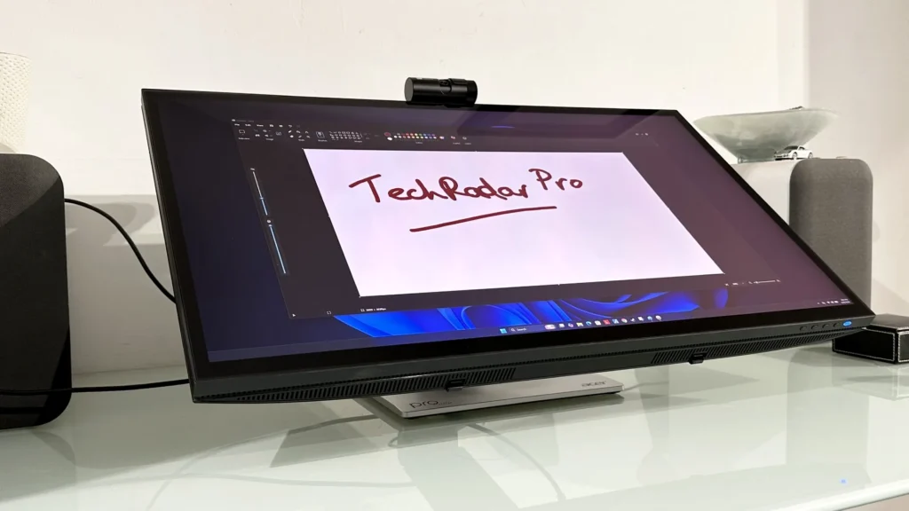 The Acer ProCreator PE320QXT on a desk in a home office during our testing process